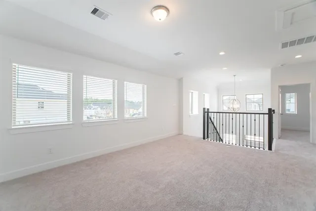 a view of a hallway with a window