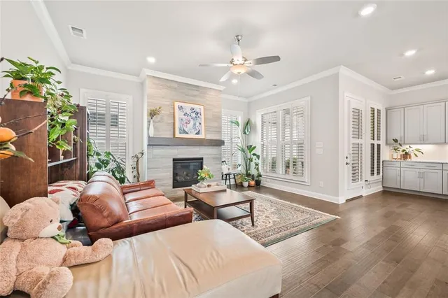 a dining room with furniture and wooden floor