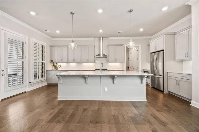 a kitchen with stainless steel appliances granite countertop a stove and a sink