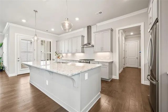 a kitchen with a refrigerator and a sink