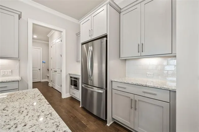 a bathroom with double sink and a mirror