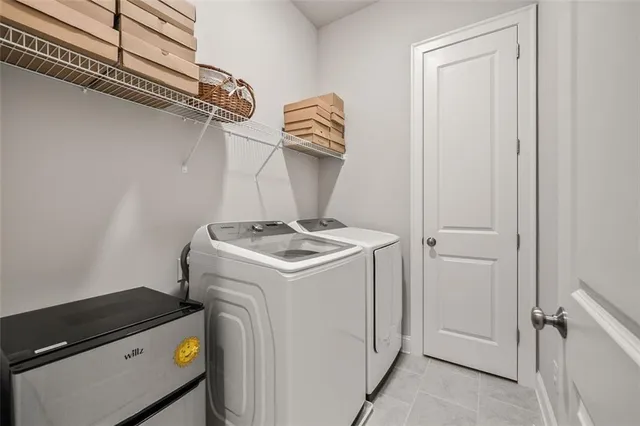 a white bath tub sitting in a bathroom next to a white door