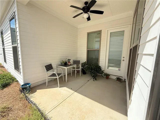 a white toilet sitting next to a shower curtain