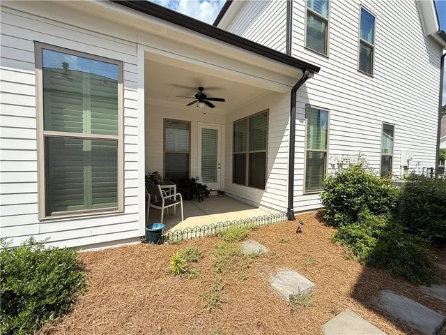 a spacious bedroom with a bed and a table