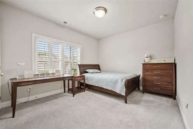 a bathroom with a sink toilet and mirror
