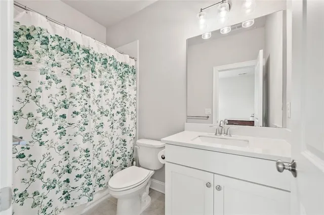 an aerial view of multiple houses with a yard