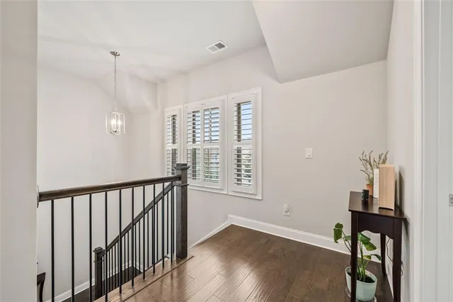 an aerial view of residential houses with outdoor space and street view
