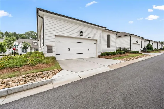 an aerial view of a swimming pool a yard and mountain view in back