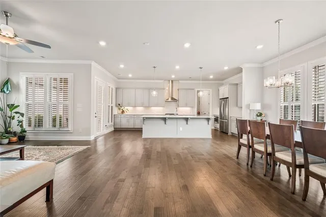 a living room with fireplace furniture and a wooden floor