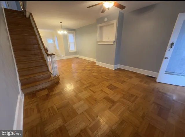 a view of an empty room with stairs