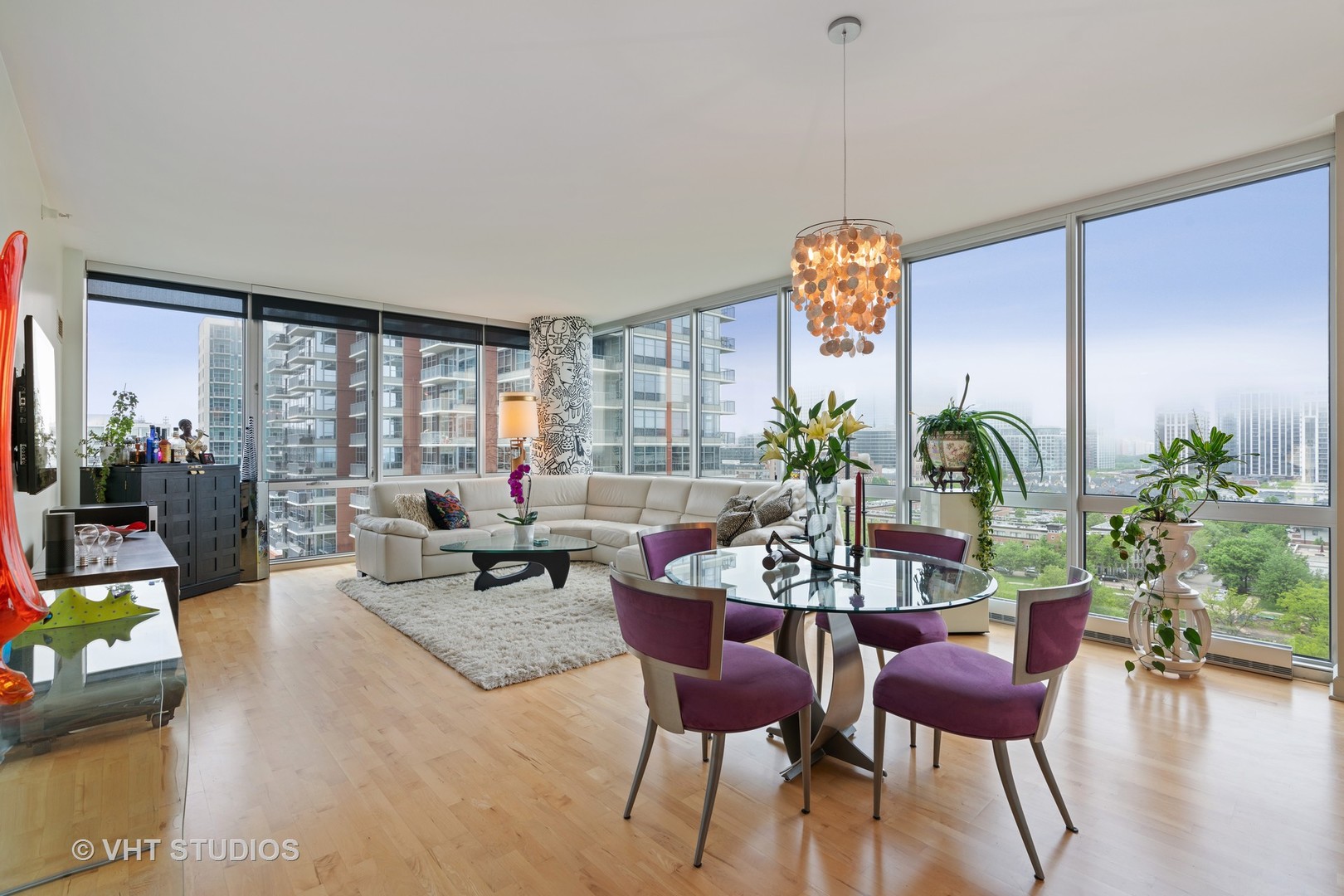 1629 South Prairie Avenue, Unit 1111 Chicago, IL 60616 - Photo 6 of 13 a dining room with furniture potted plants and wooden floor