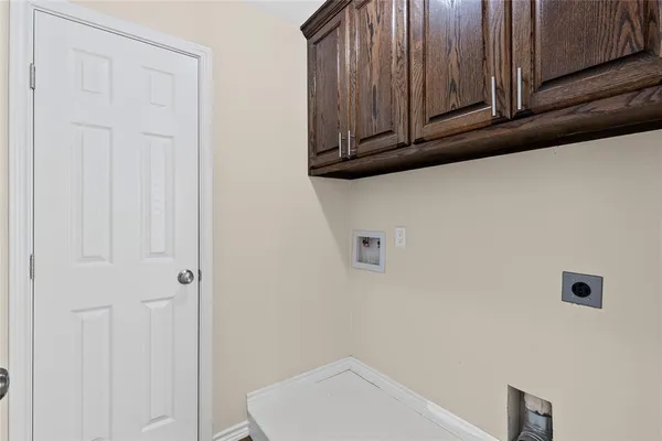 a bathroom with a sink and cabinets