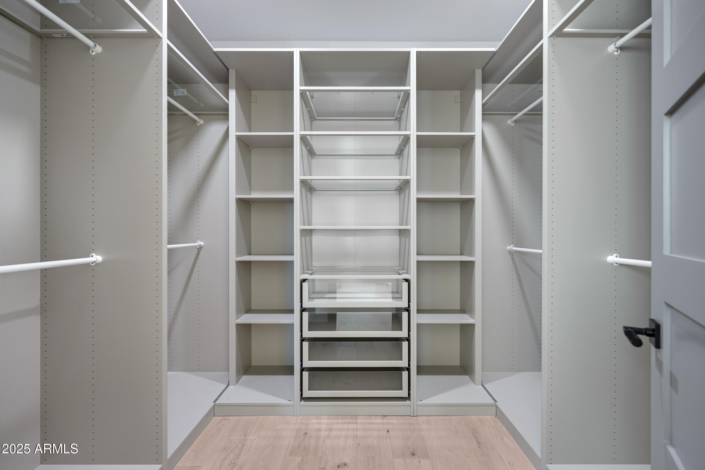 3102 East Agritopia Loop North Gilbert, AZ 85296 - Photo 26 of 75 a view of walk in closet with empty racks