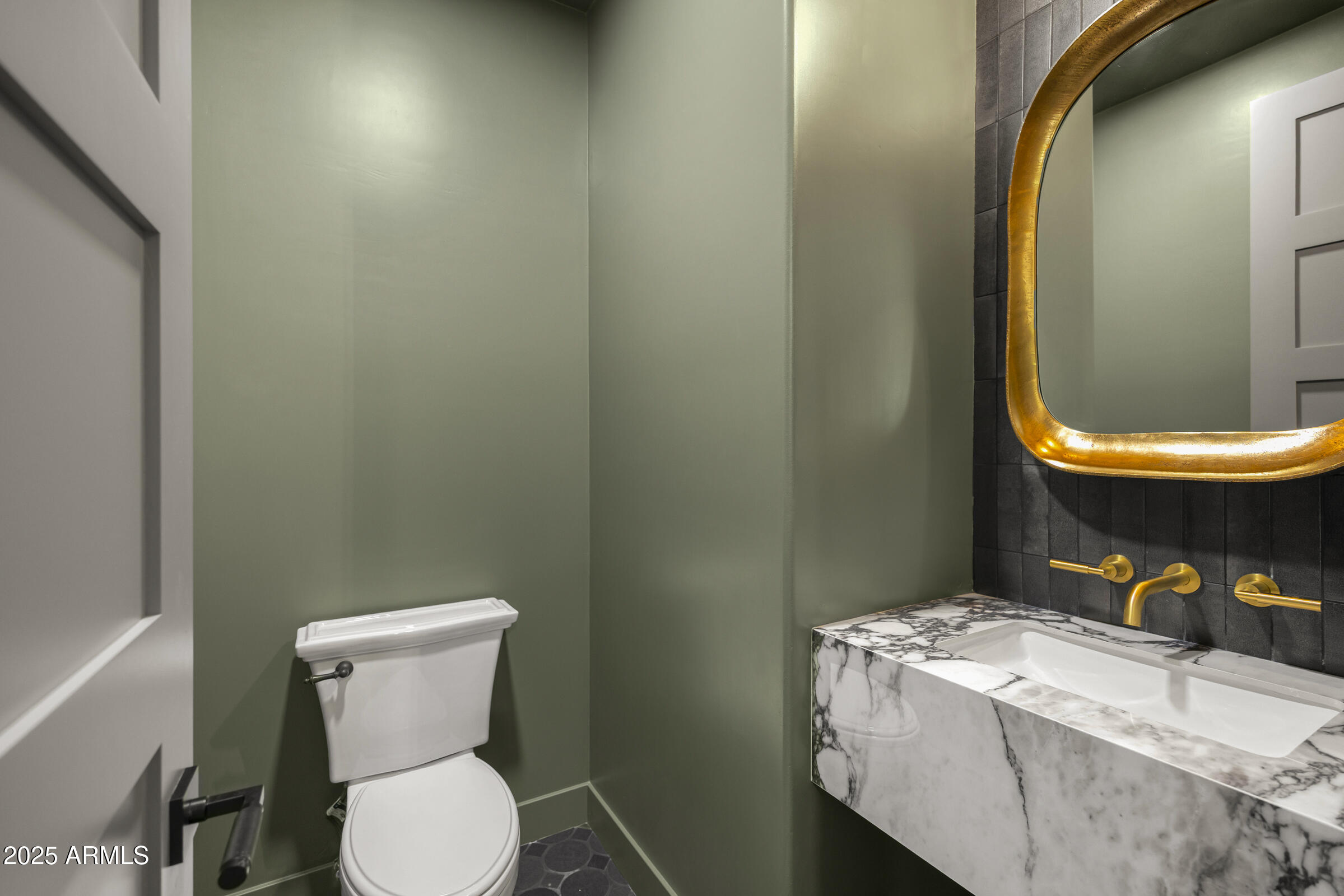 3102 East Agritopia Loop North Gilbert, AZ 85296 - Photo 28 of 75 a white toilet sitting next to a bathroom sink