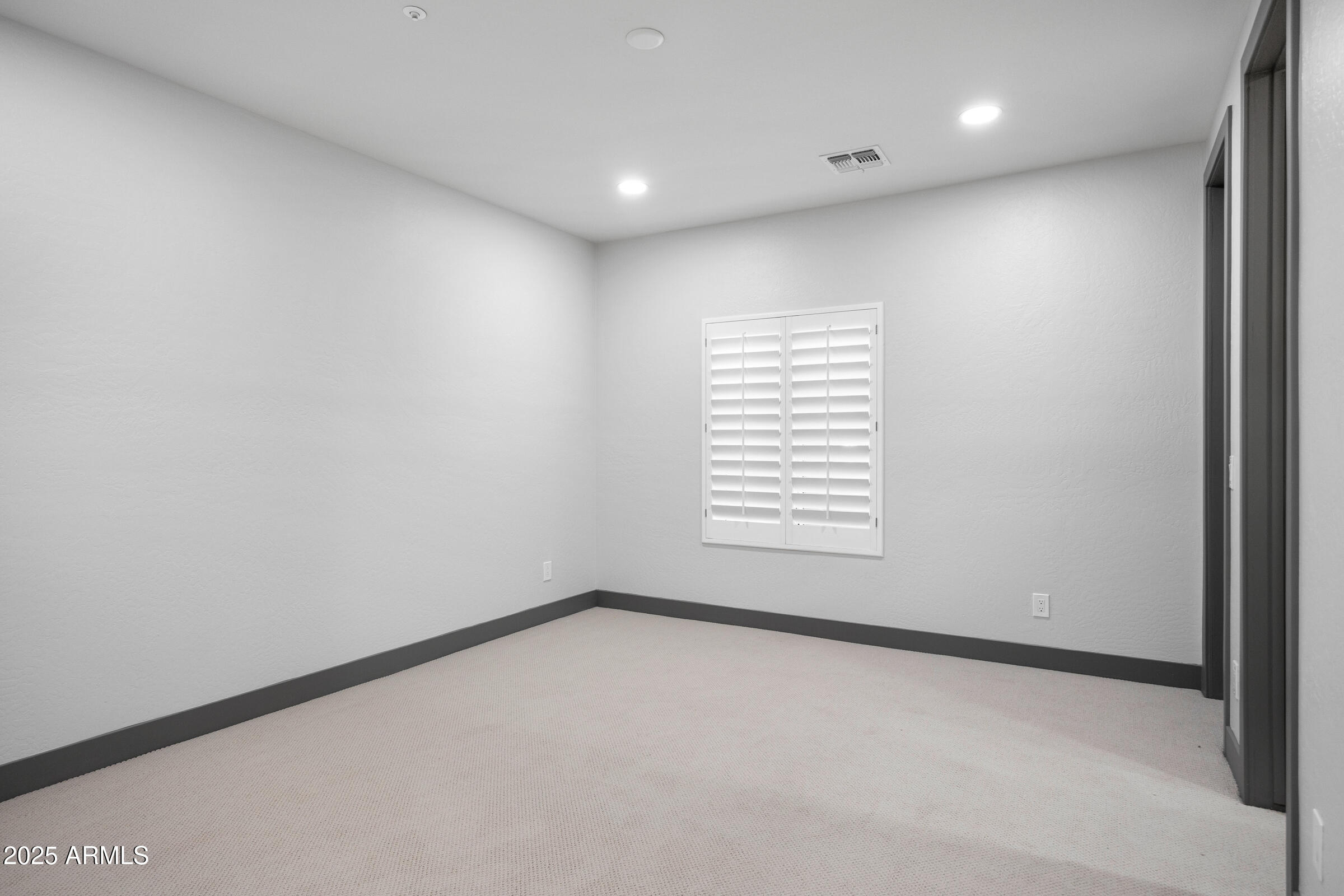 3102 East Agritopia Loop North Gilbert, AZ 85296 - Photo 39 of 75 a view of an empty room with a window