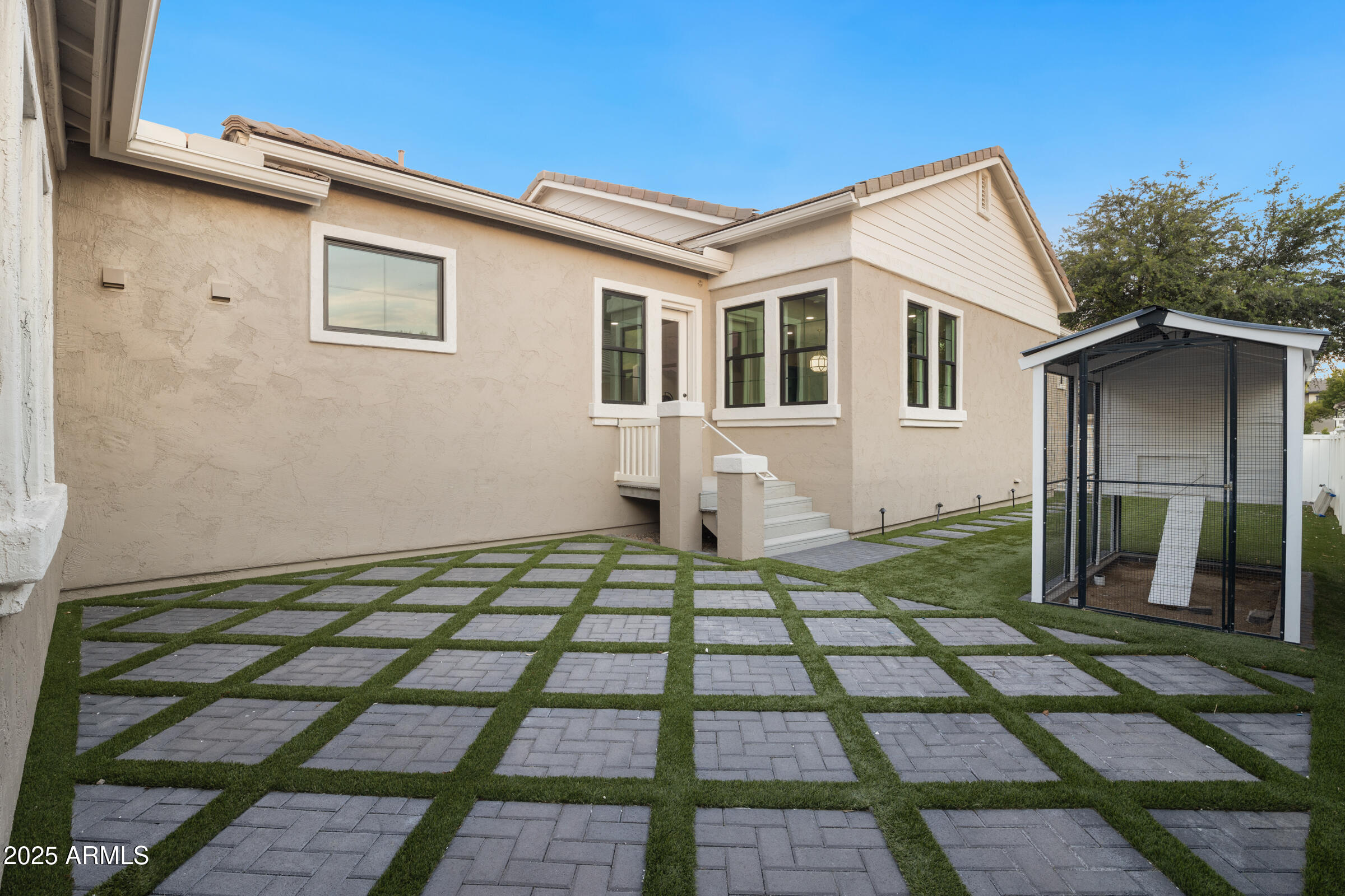 3102 East Agritopia Loop North Gilbert, AZ 85296 - Photo 46 of 75 a front view of a house with a yard