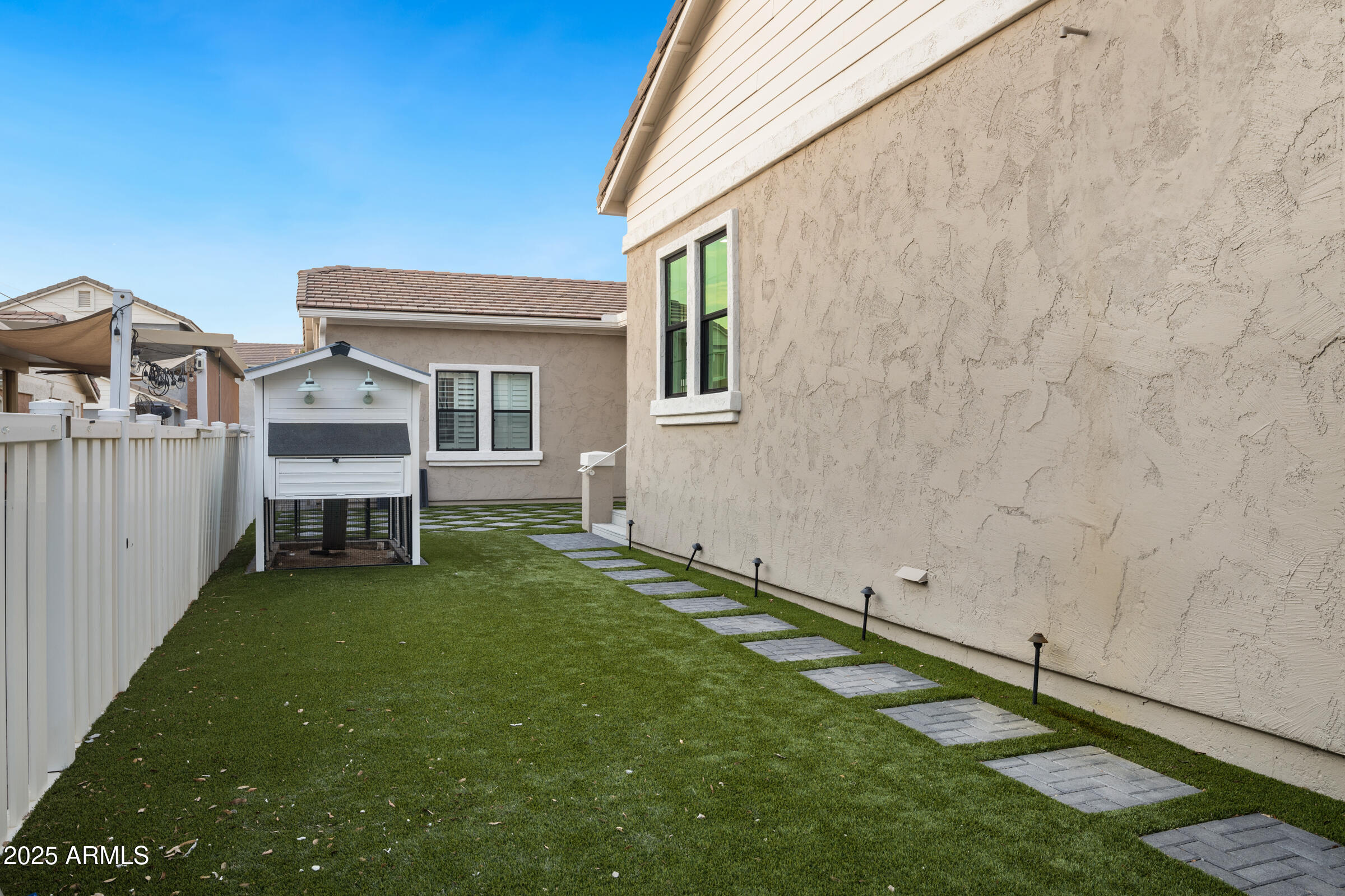 3102 East Agritopia Loop North Gilbert, AZ 85296 - Photo 54 of 75 a view of an house with backyard and deck