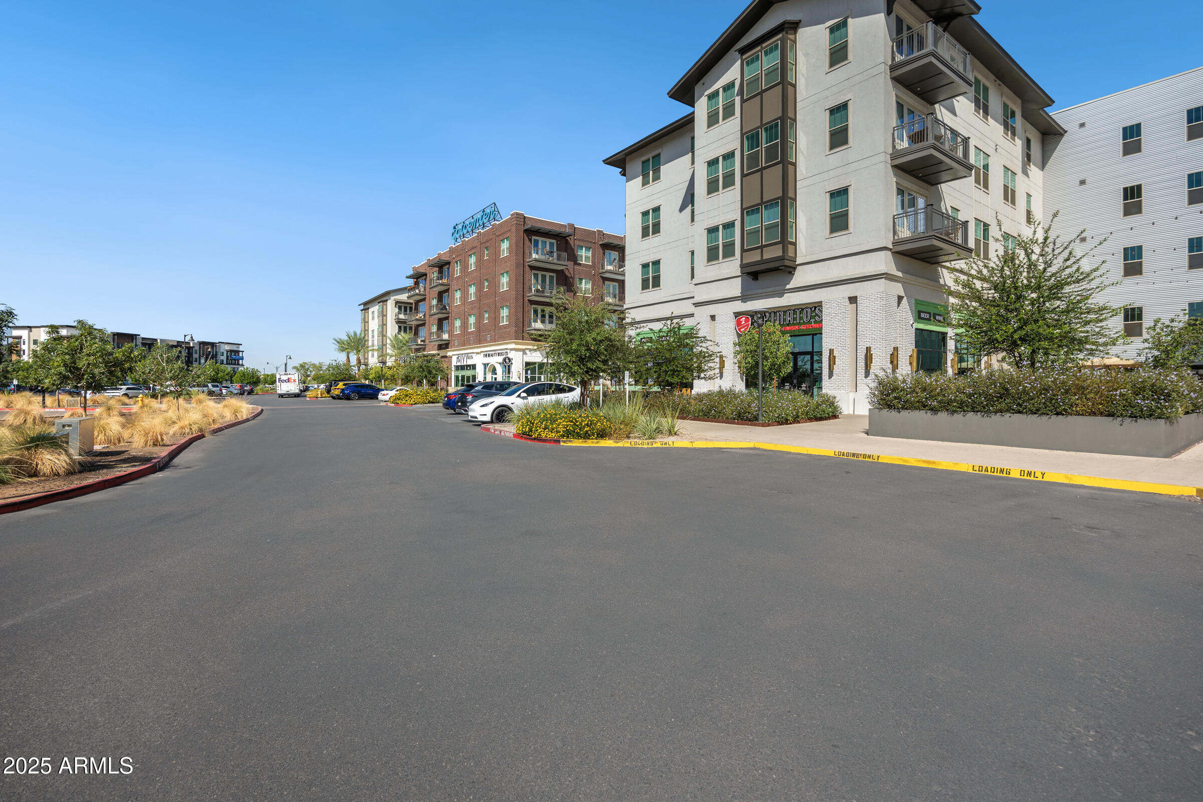 3102 East Agritopia Loop North Gilbert, AZ 85296 - Photo 67 of 75 a view of a street with a building in the background