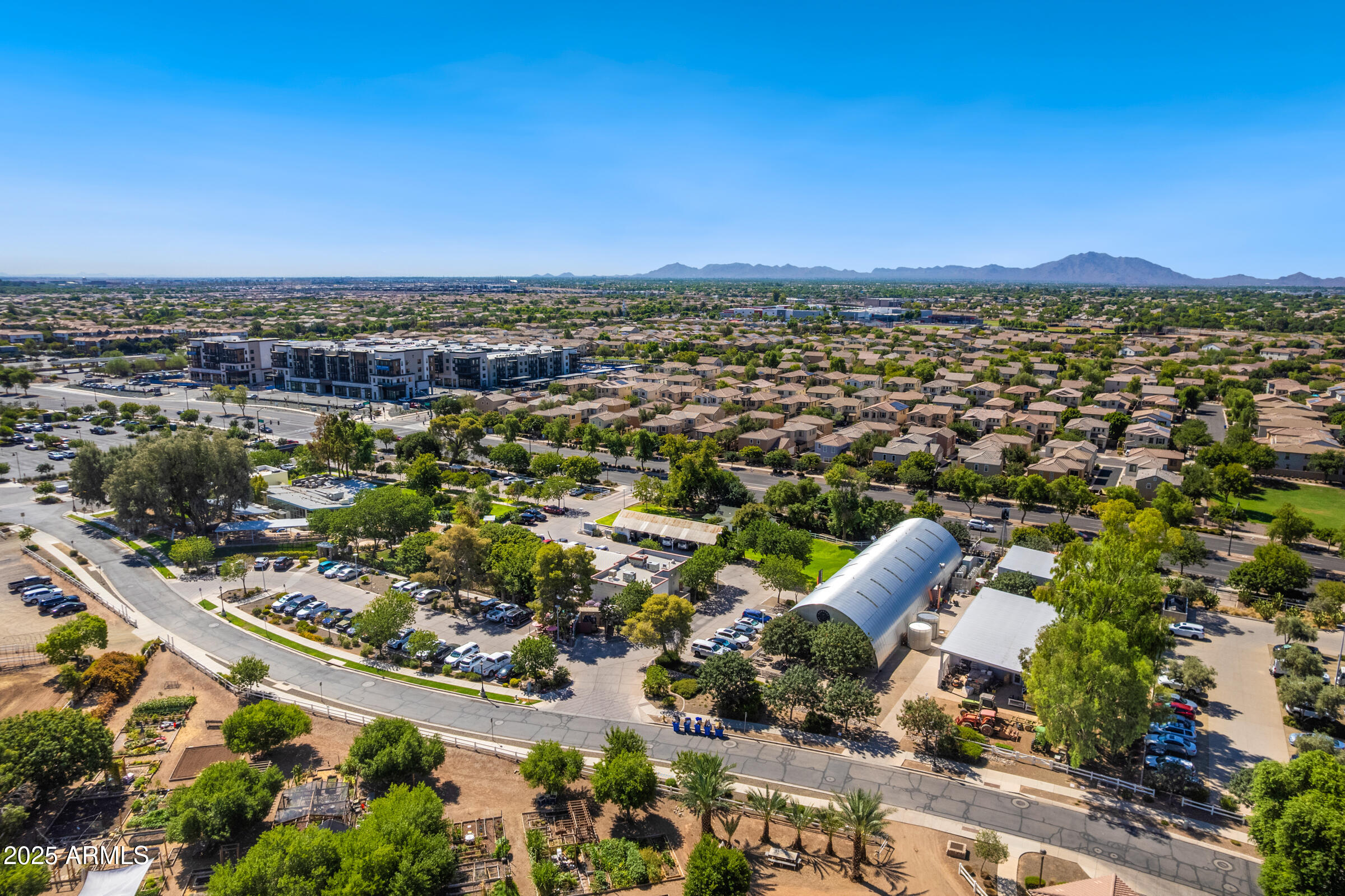 3102 East Agritopia Loop North Gilbert, AZ 85296 - Photo 75 of 75 an aerial view of a city with lots of residential buildings