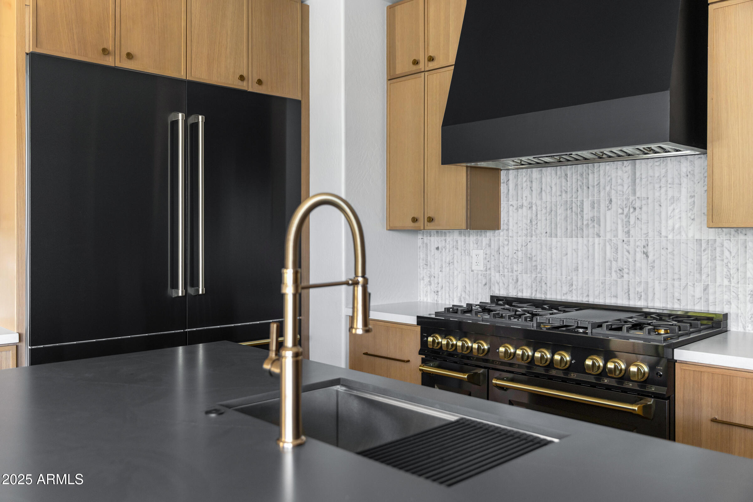 3102 East Agritopia Loop North Gilbert, AZ 85296 - Photo 9 of 75 a kitchen with stainless steel appliances granite countertop a refrigerator and a stove