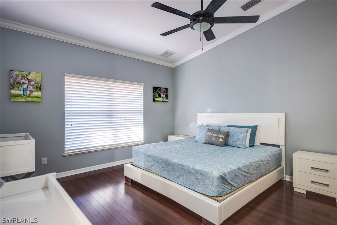 9036 Henry Road Fort Myers, FL 33967 - Photo 15 of 22 a bedroom with a large bed and a window