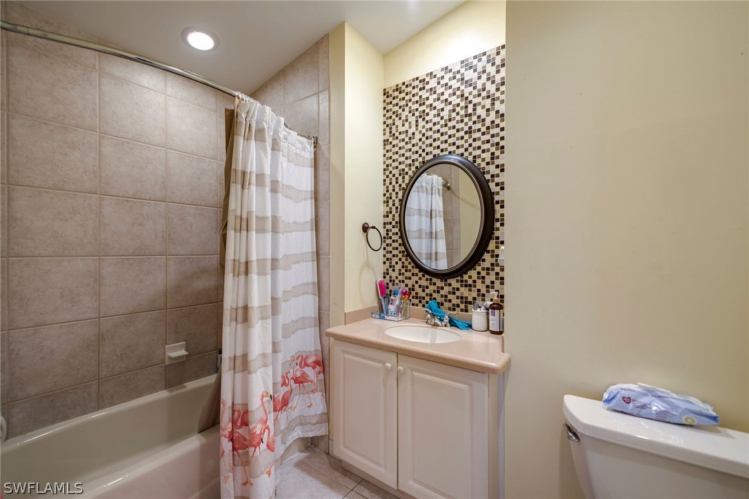 9036 Henry Road Fort Myers, FL 33967 - Photo 18 of 22 a bathroom with a sink a toilet and a shower