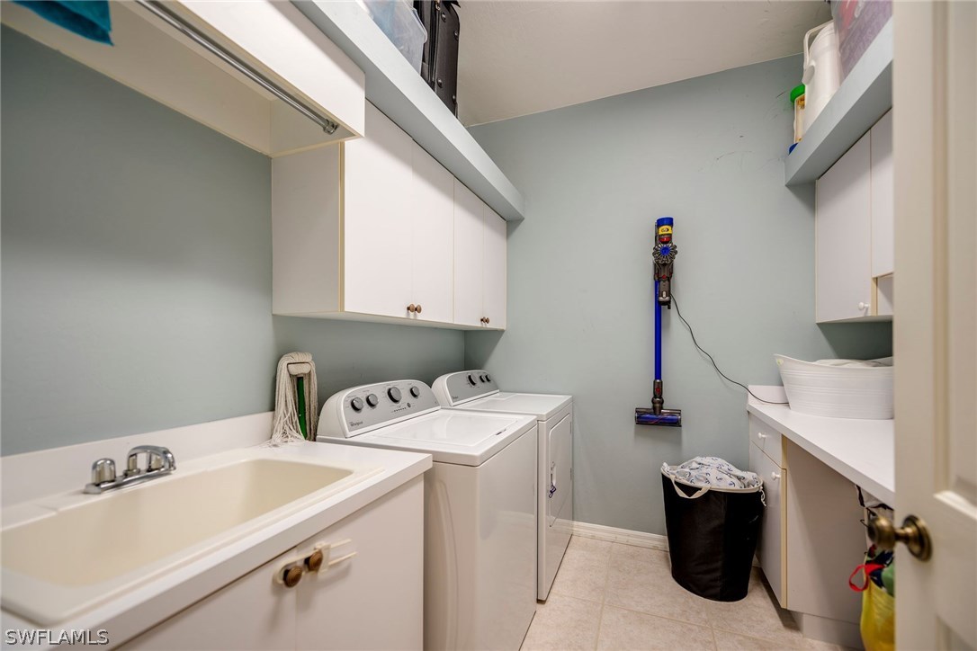 9036 Henry Road Fort Myers, FL 33967 - Photo 19 of 22 a utility room with dryer and washer