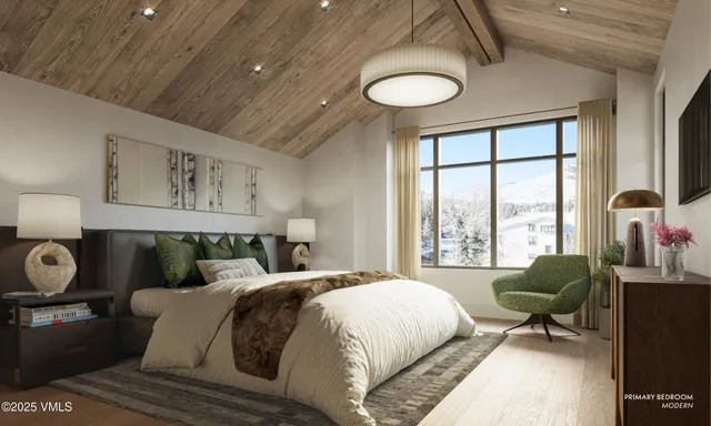a spacious bedroom with a bed and window