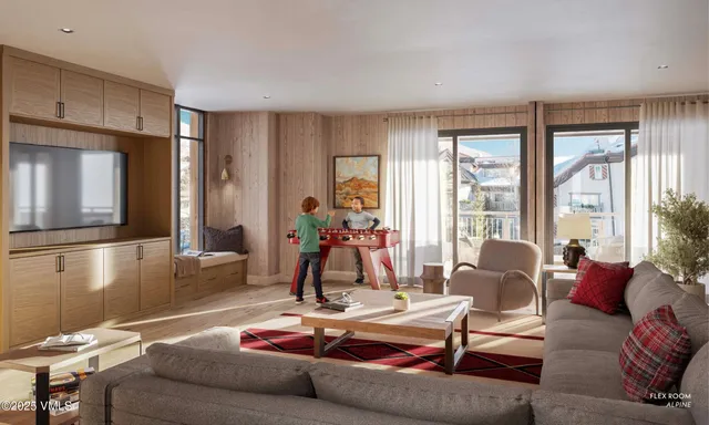 a living room with furniture and a floor to ceiling window