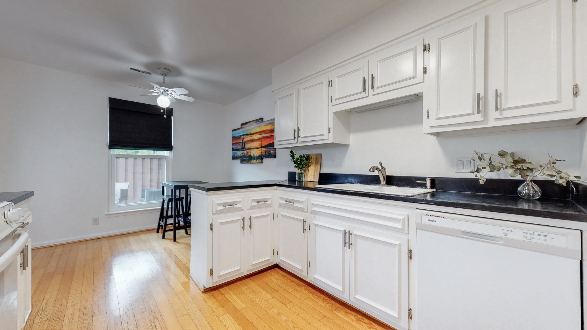 839 General George Patton Road Nashville, TN 37221 - Photo 11 of 59 a kitchen with white cabinets and sink