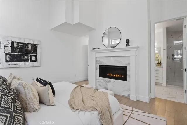 a bedroom with a large bed and a window