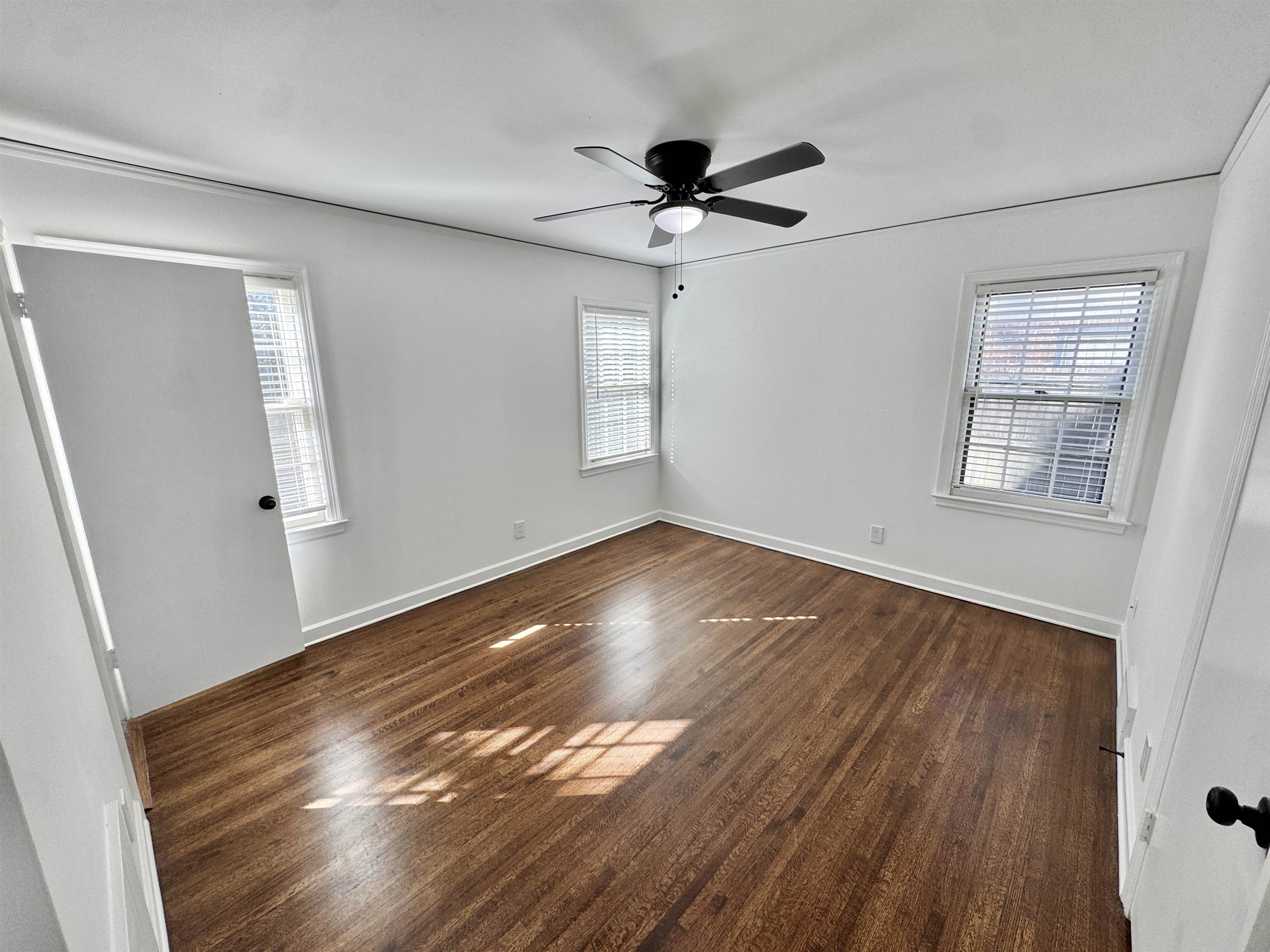 4417 Fair Meadow Road Memphis, TN 38117 - Photo 16 of 38 Unfurnished room with dark wood-style flooring, plenty of natural light, and ceiling fan