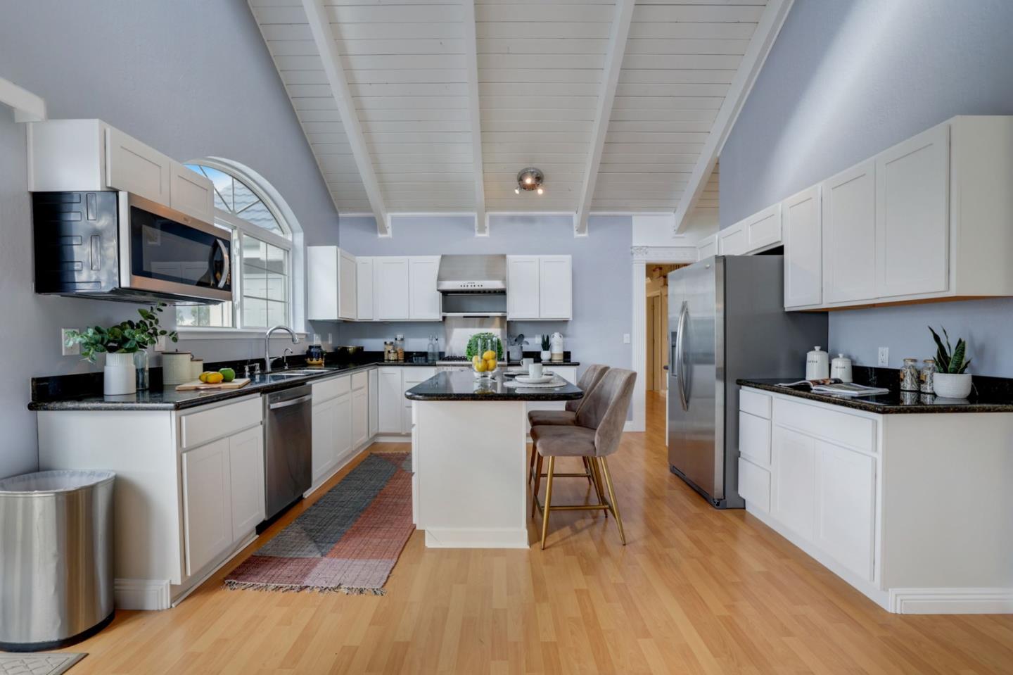 3303 Americus Drive San Jose, CA 95148 - Photo 11 of 51 a kitchen with stainless steel appliances granite countertop a refrigerator a stove top oven a sink dishwasher and white cabinets with wooden floor