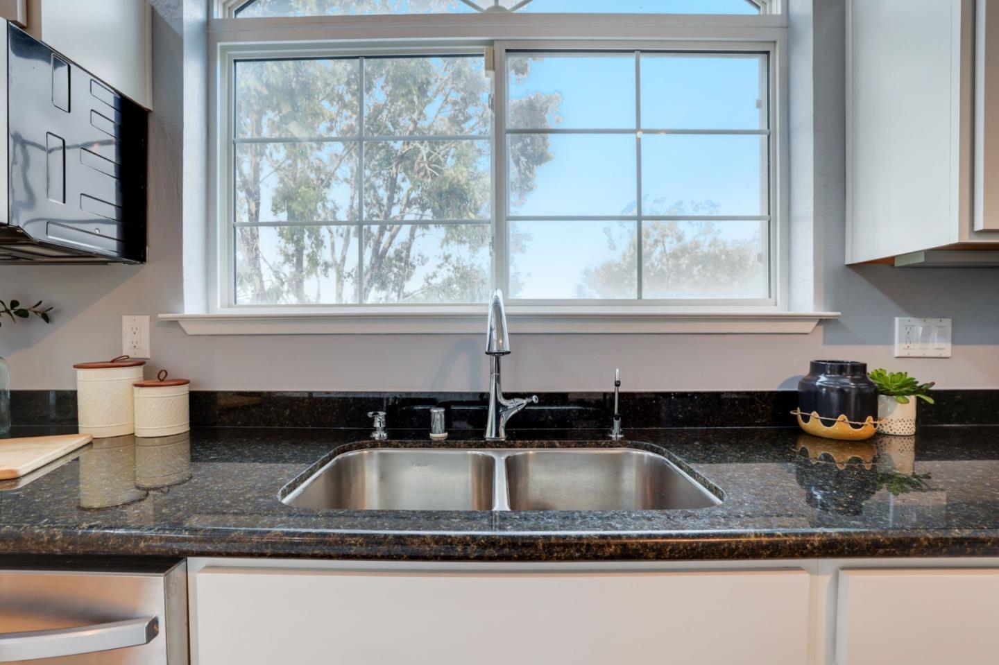 3303 Americus Drive San Jose, CA 95148 - Photo 15 of 51 a kitchen sink with granite countertop a sink a window and cabinets