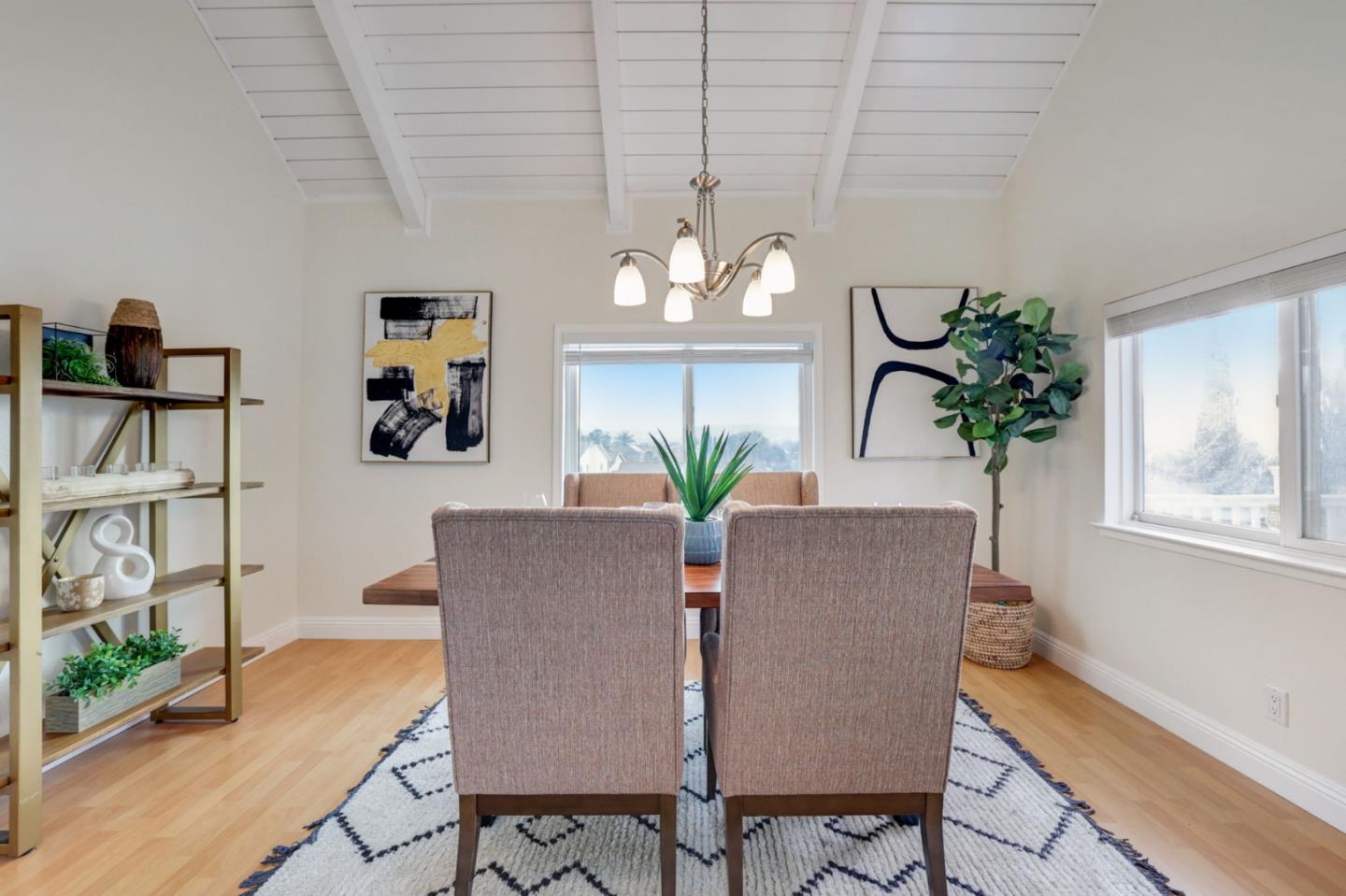 3303 Americus Drive San Jose, CA 95148 - Photo 17 of 51 a view of a dining room with furniture a potted plant and wooden floor