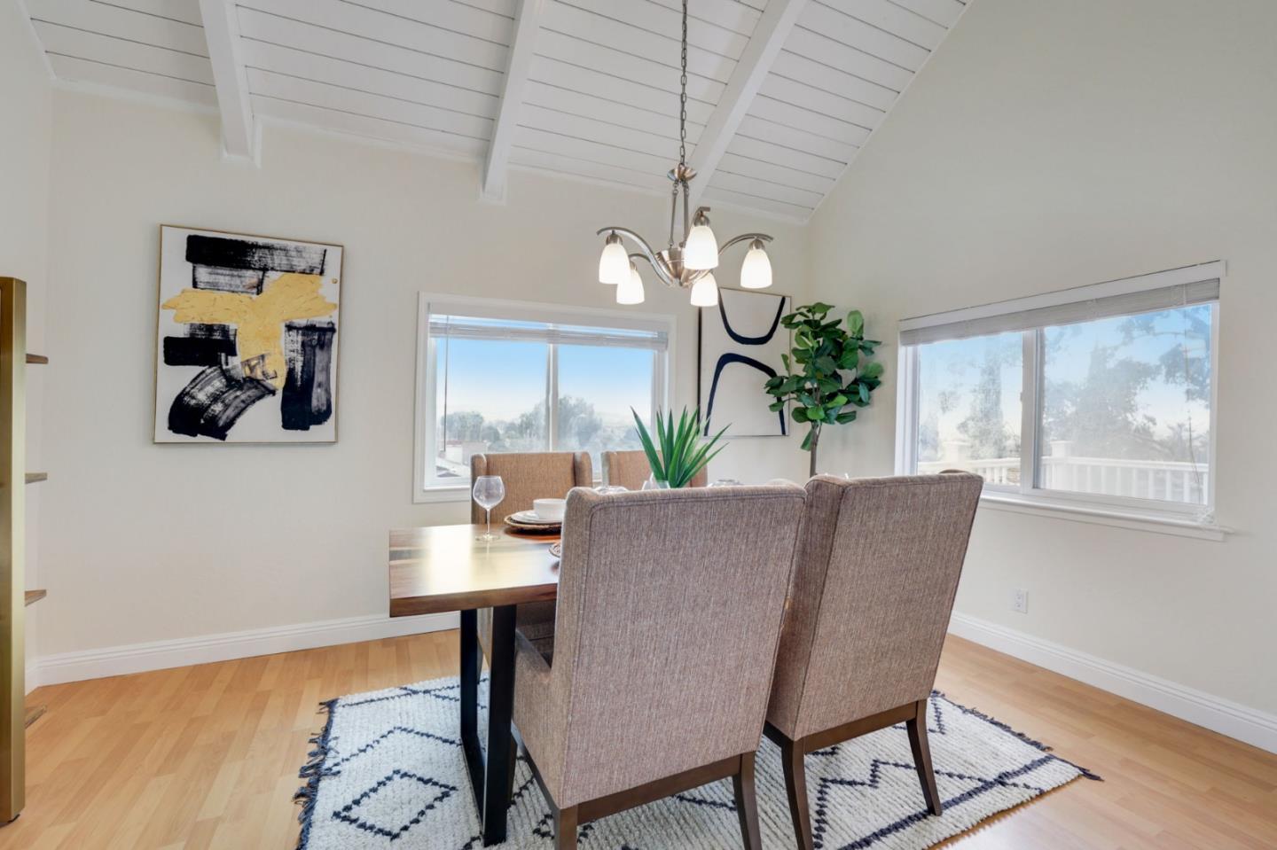 3303 Americus Drive San Jose, CA 95148 - Photo 18 of 51 a view of a dining room with furniture and a potted plant