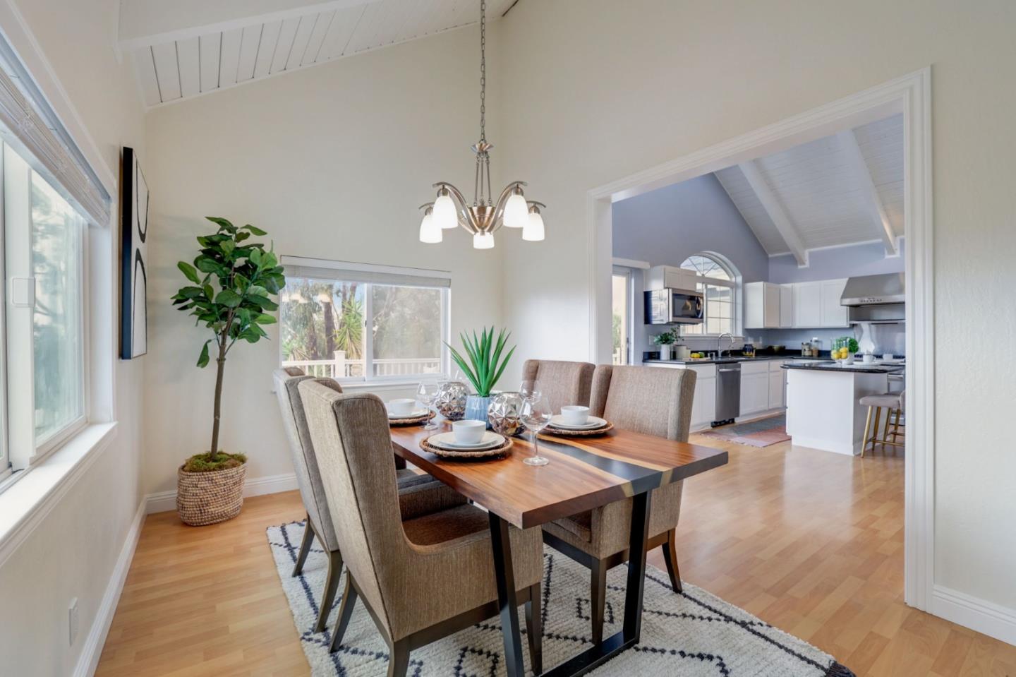 3303 Americus Drive San Jose, CA 95148 - Photo 19 of 51 a view of a dining room with furniture and a chandelier