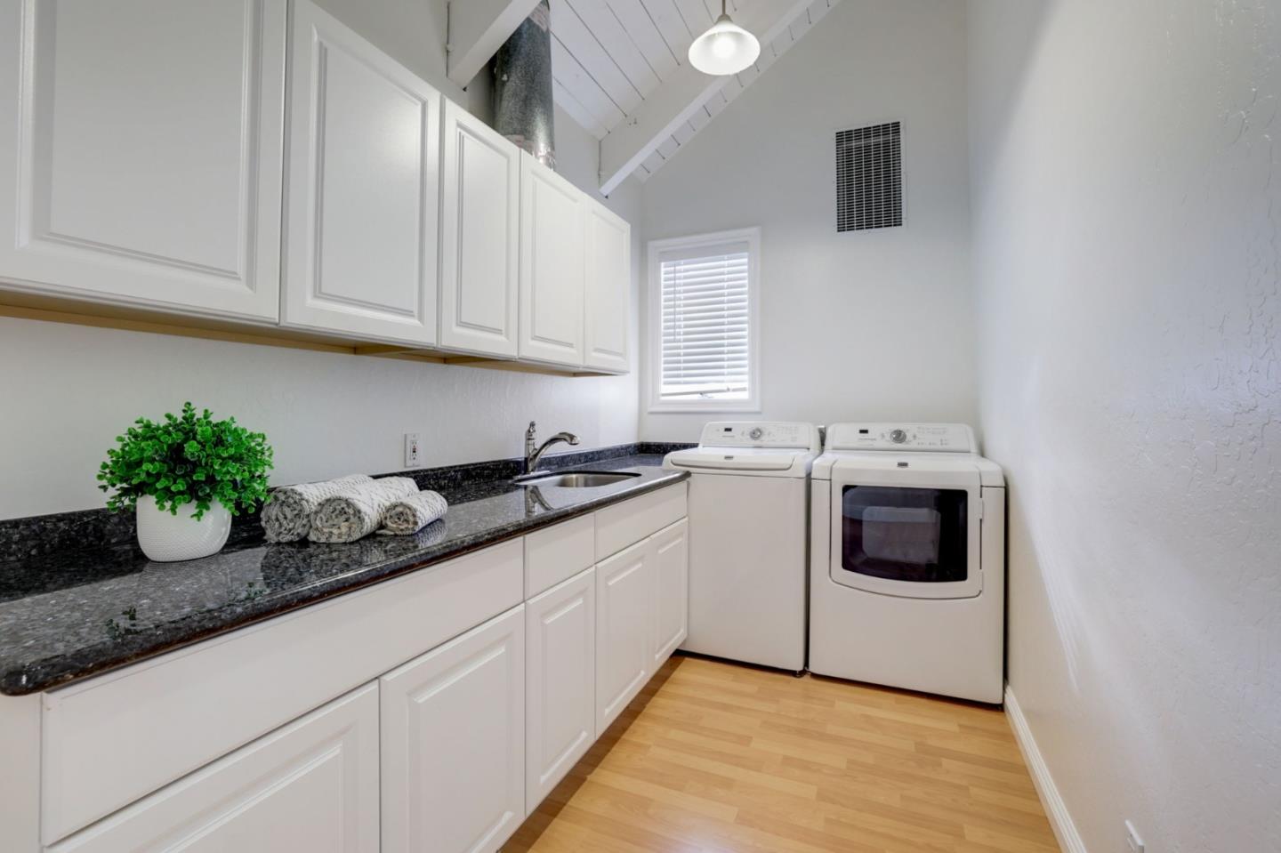 3303 Americus Drive San Jose, CA 95148 - Photo 20 of 51 a kitchen with granite countertop white cabinets and white appliances
