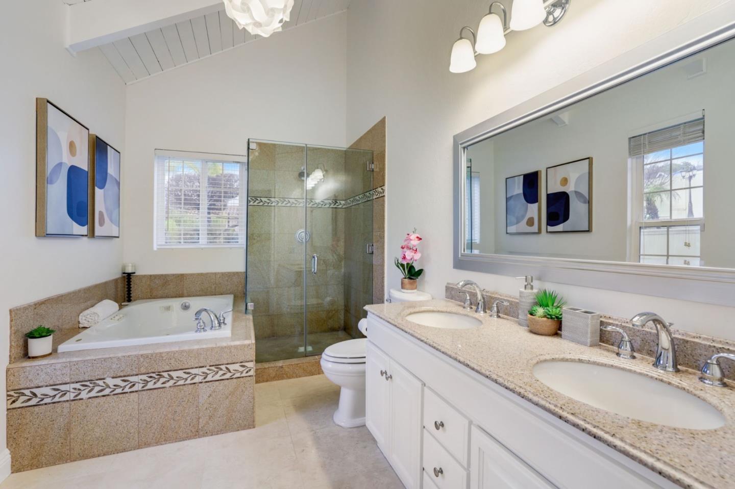 3303 Americus Drive San Jose, CA 95148 - Photo 24 of 51 a spacious bathroom with a granite countertop double vanity sink a mirror a bathtub and a toilet