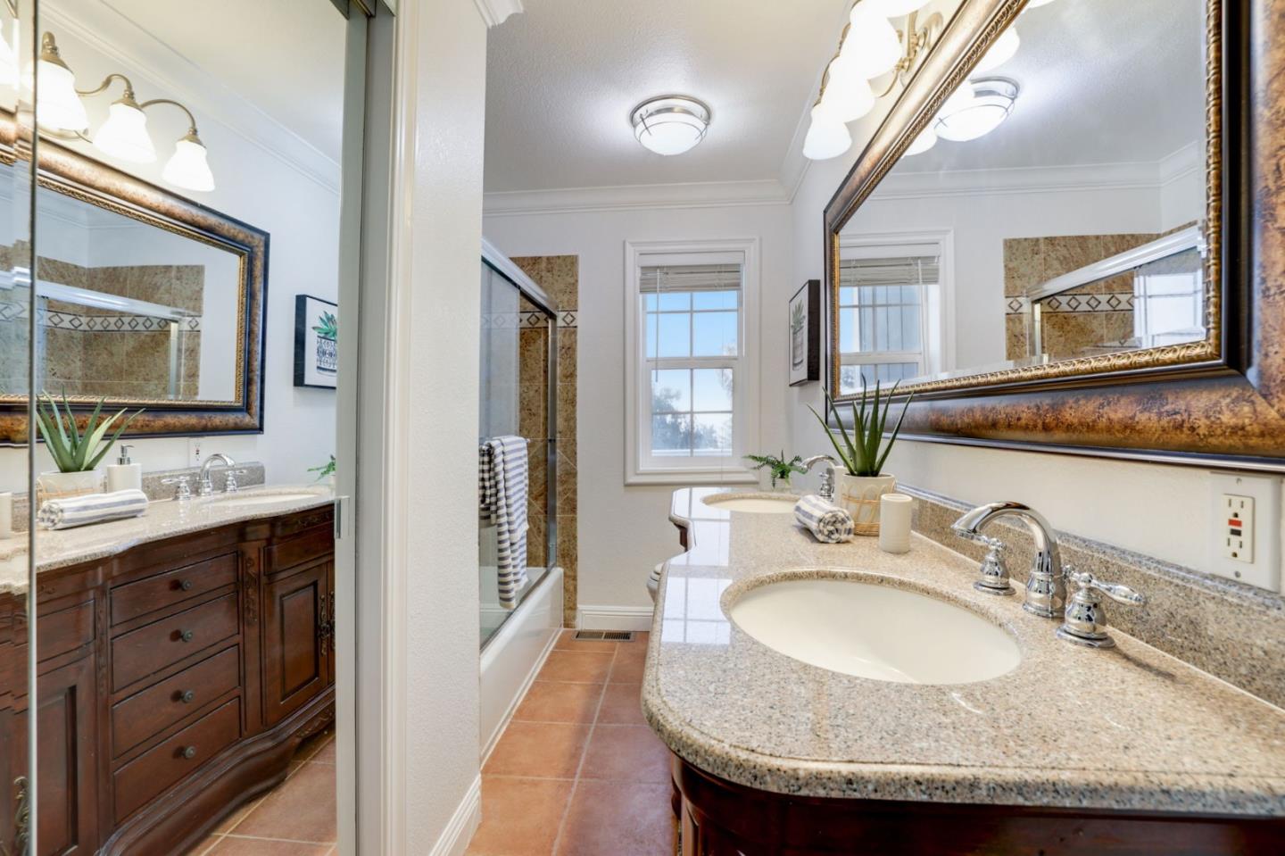 3303 Americus Drive San Jose, CA 95148 - Photo 28 of 51 a bathroom with a granite countertop sink and a mirror