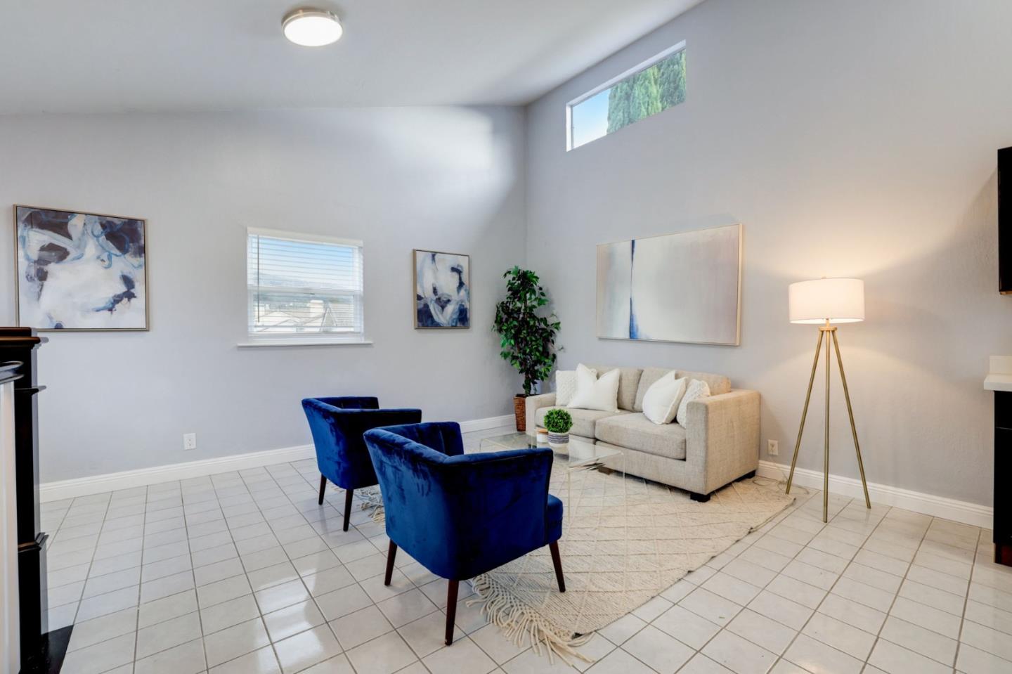 3303 Americus Drive San Jose, CA 95148 - Photo 36 of 51 a living room with furniture and a lamp