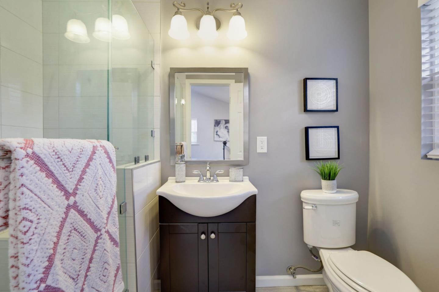 3303 Americus Drive San Jose, CA 95148 - Photo 38 of 51 a bathroom with a sink toilet and a mirror