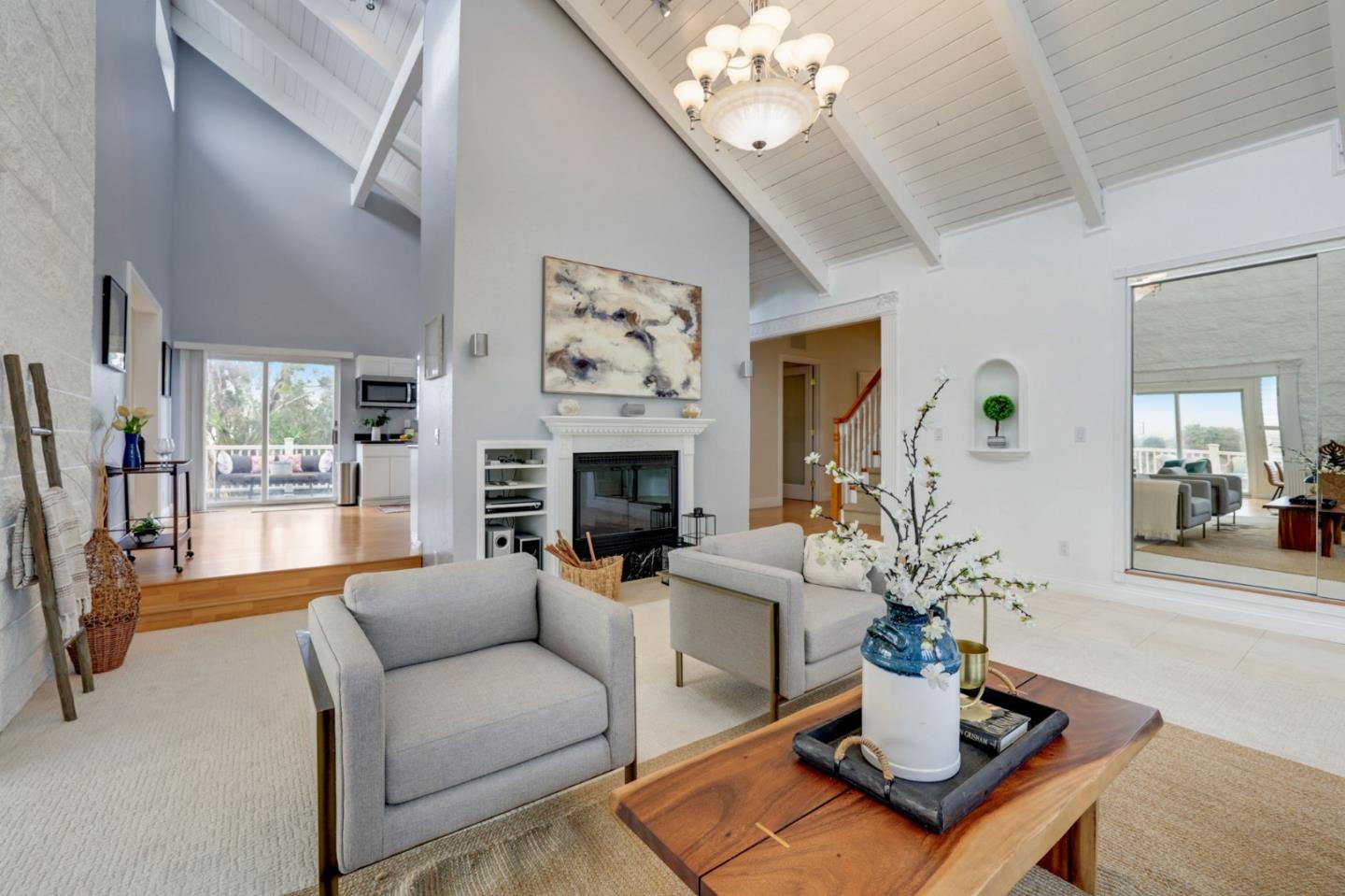 3303 Americus Drive San Jose, CA 95148 - Photo 6 of 51 a living room with furniture a chandelier and a fireplace