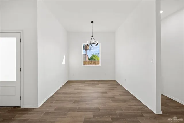 an empty room that has a window in it