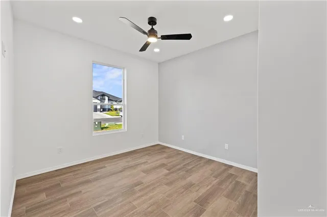 an empty room with wooden floor