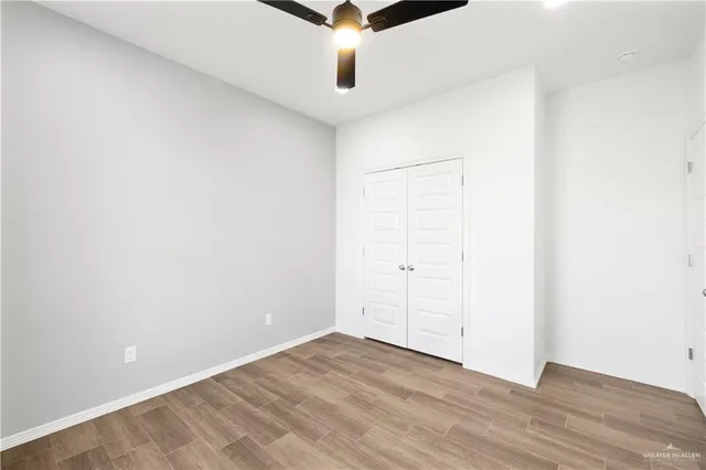 an empty room with wooden floor