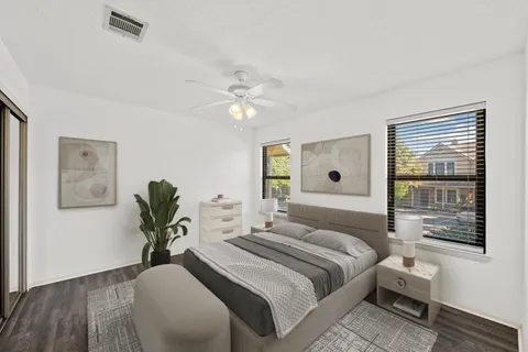 a bedroom with a large bed and a window