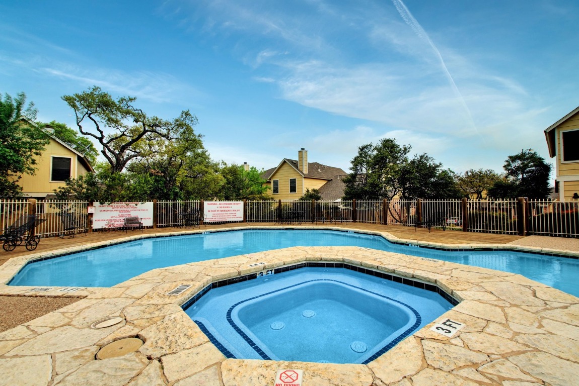 11901 Swearingen Drive, Unit 39 Austin, TX 78758 - Photo 22 of 25 a view of a swimming pool with a lounge chair