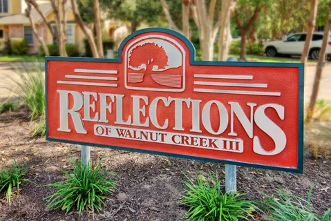 a sign that is on a brick wall