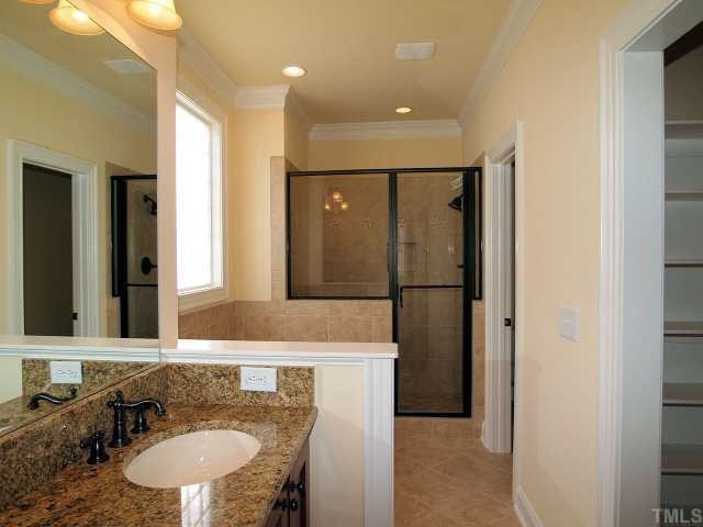 3109 Raymond Street Raleigh, NC 27607 - Photo 10 of 12 Luxurious master bath features whirpool tub, separate shower, and double sink vanity with granite countertop. Master Bath/Spa